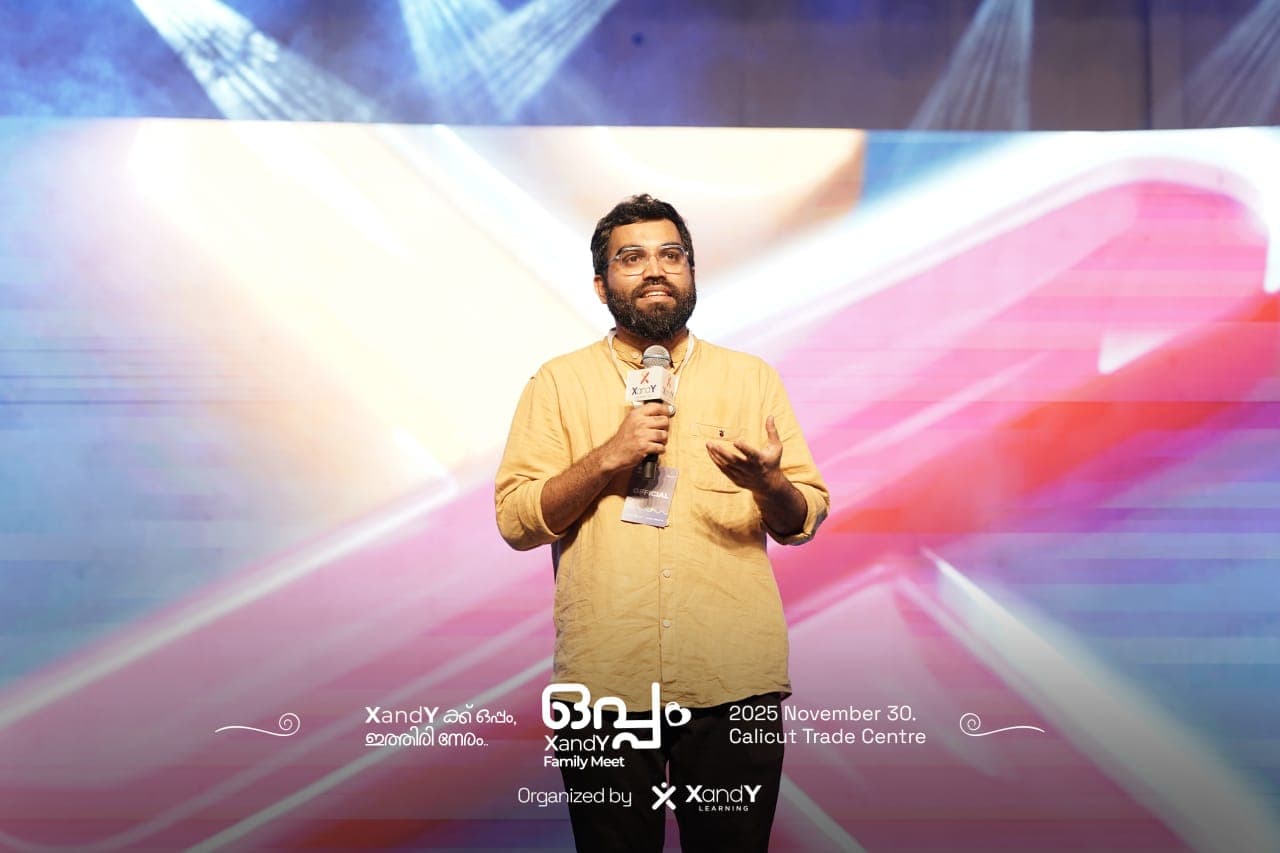 Ajmal Sir presenting at an XandY Learning event